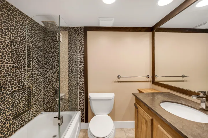 Bathroom featuring vanity and shower / bath combination