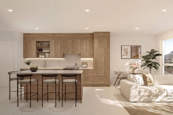 Open-concept living area with a large kitchen island, light wood-finish cabinetry, recessed ceiling lighting, a dedicated dining area, and a large window with mountain scenery