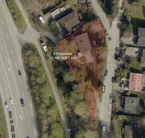 Aerial map of property and surrounding area featuring property boundaries highlighted