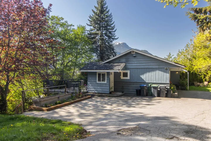Rear view of property with a garden