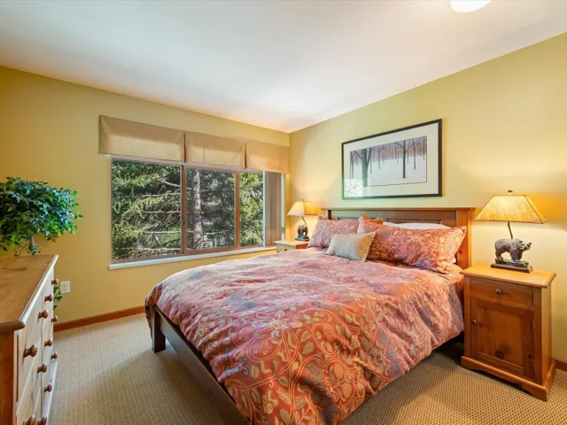Carpeted bedroom with baseboards