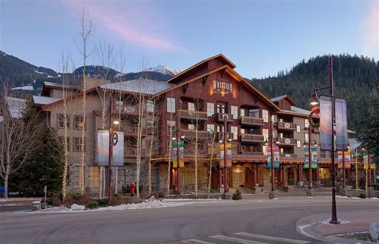 Property at dusk with a mountain view