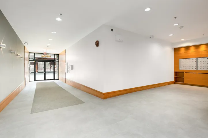 Common area featuring recessed lighting and a wall of windows