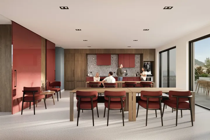 Open-concept room featuring integrated wood cabinetry, a kitchen area with a speckled backsplash, a spacious dining table, and large sliding glass doors leading to an outdoor area