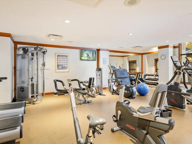 Workout area featuring recessed lighting and crown molding