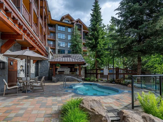 View of swimming pool featuring a gazebo, a patio area, a community hot tub, and outdoor dining area