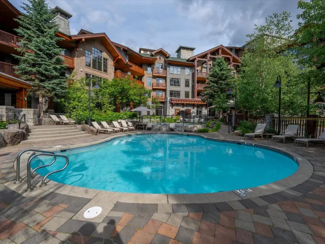 Community pool featuring a patio