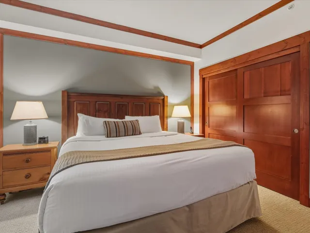 Bedroom featuring carpet, a closet, and crown molding
