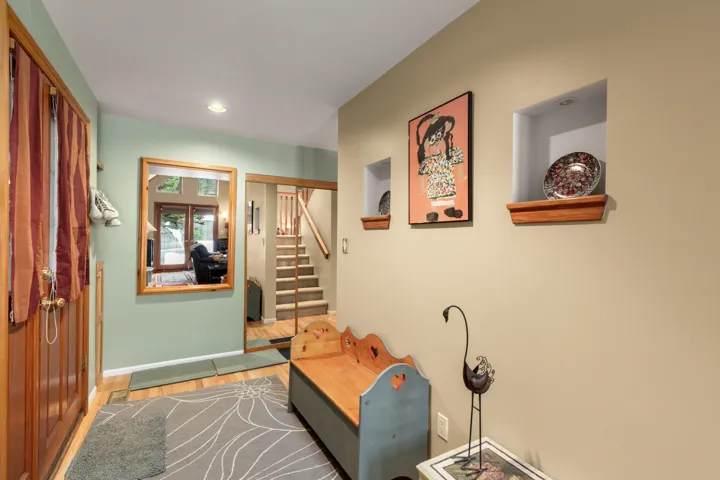 Entrance foyer featuring light wood finished floors and recessed lighting