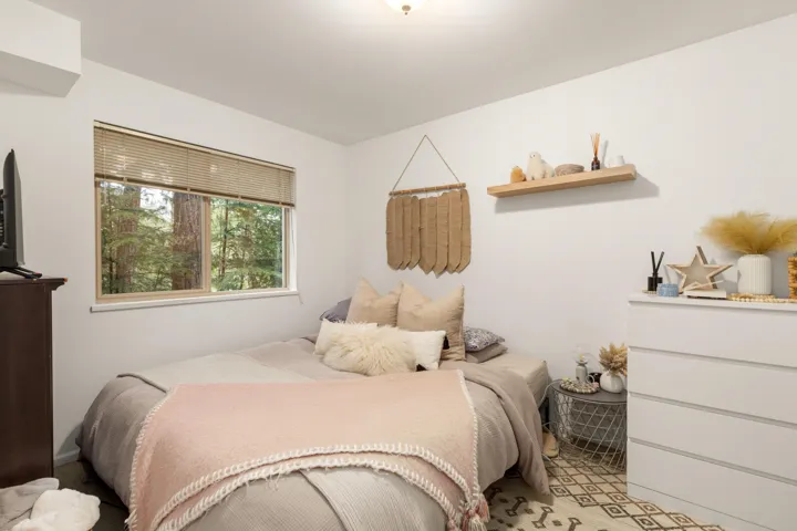 Bedroom with light carpet