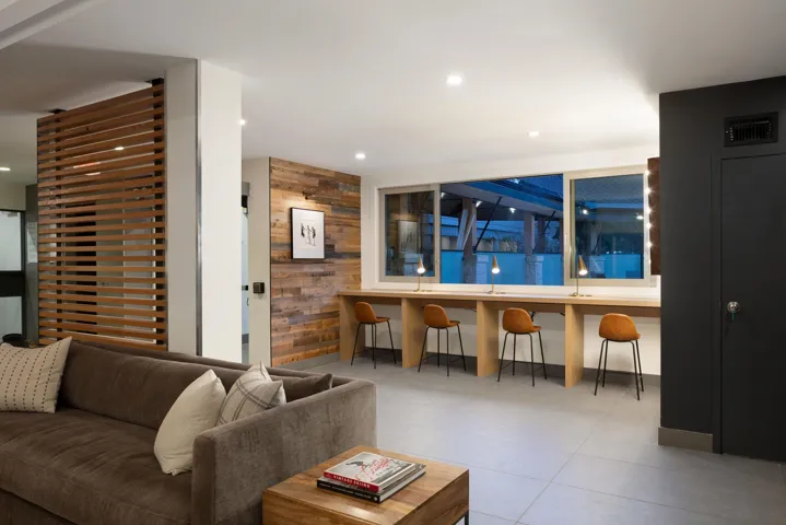 Living room with wooden walls and recessed lighting