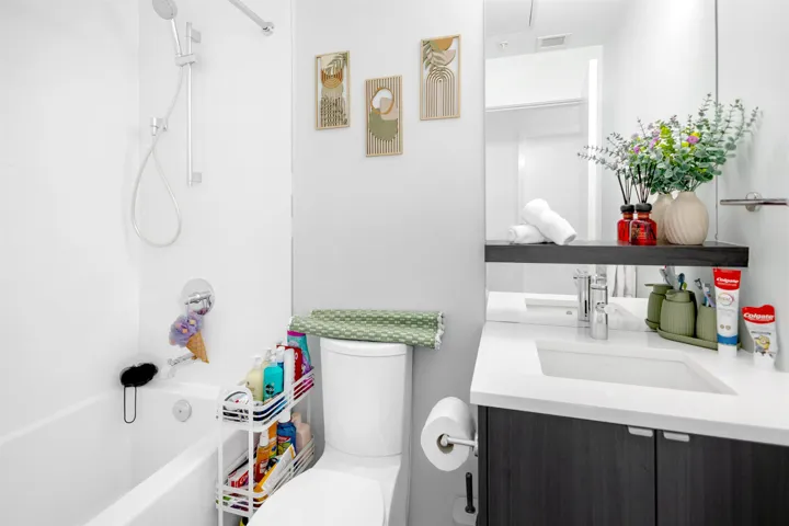 Bathroom with vanity and shower / tub combination