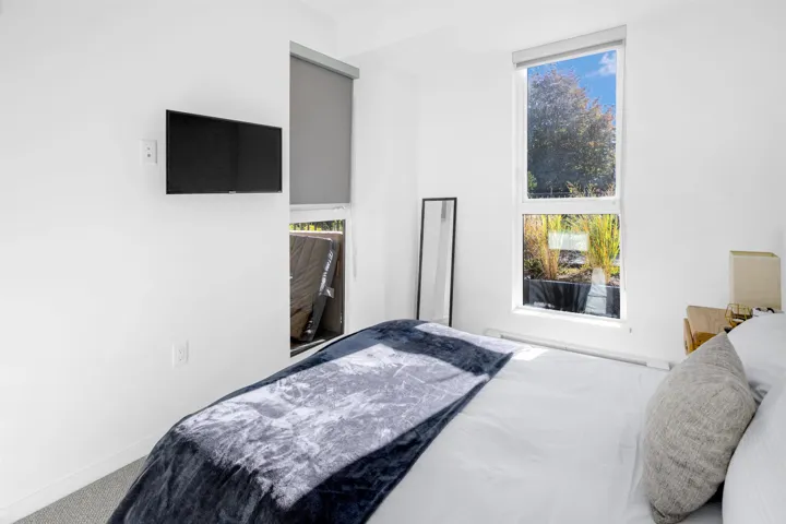Bedroom with carpet floors and baseboards