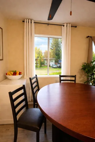 Dining room with healthy amount of natural light and wood finished floors