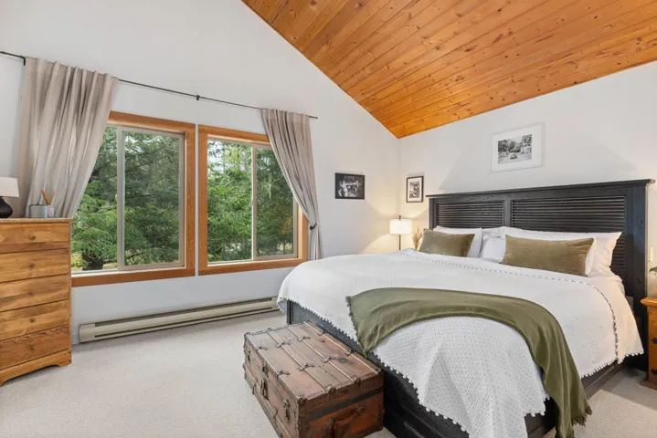 Bedroom featuring carpet floors, wooden ceiling, high vaulted ceiling, and baseboard heating