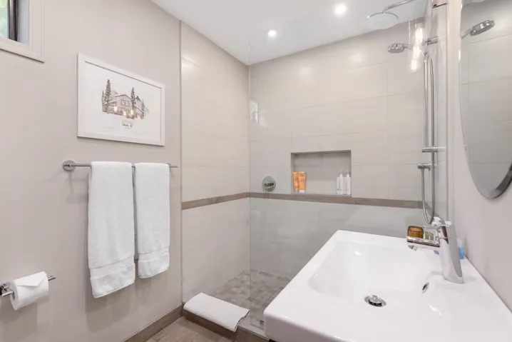 Bathroom with recessed lighting, a sink, and a walk in shower