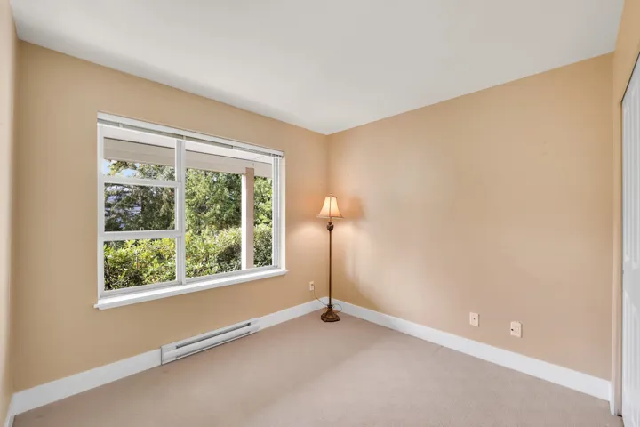 Lower level bedroom with private views into the forest