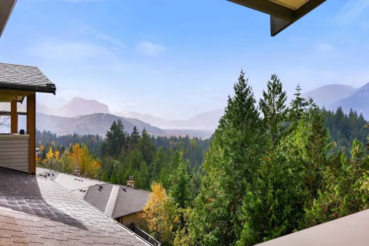Upper balcony off the primary bedroom with water and mountain views