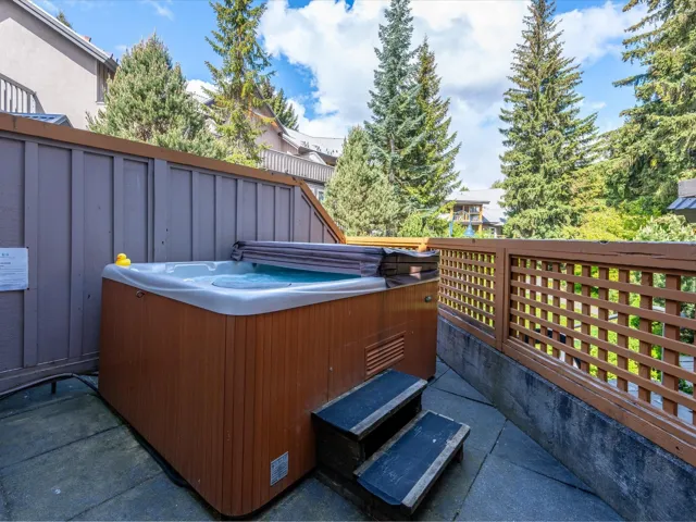 View of patio / terrace with a hot tub