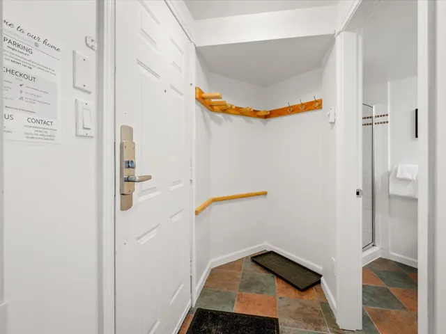 Walk in closet featuring stone tile flooring