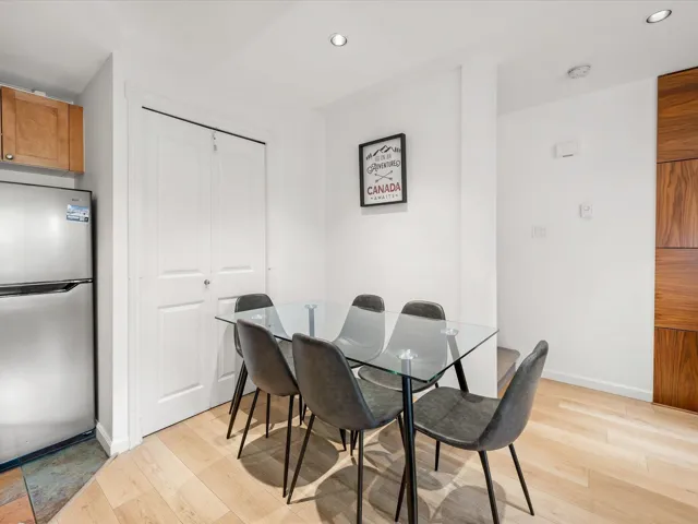 Dining room with light wood-style floors, recessed lighting, and baseboards