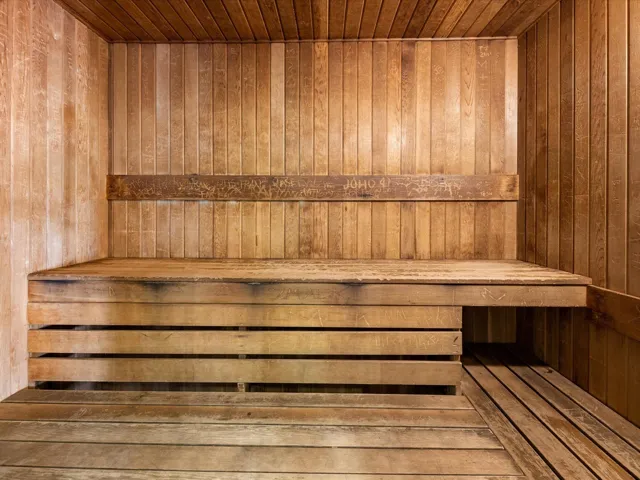 Relaxing sauna / steam room with wood ceiling and wood walls