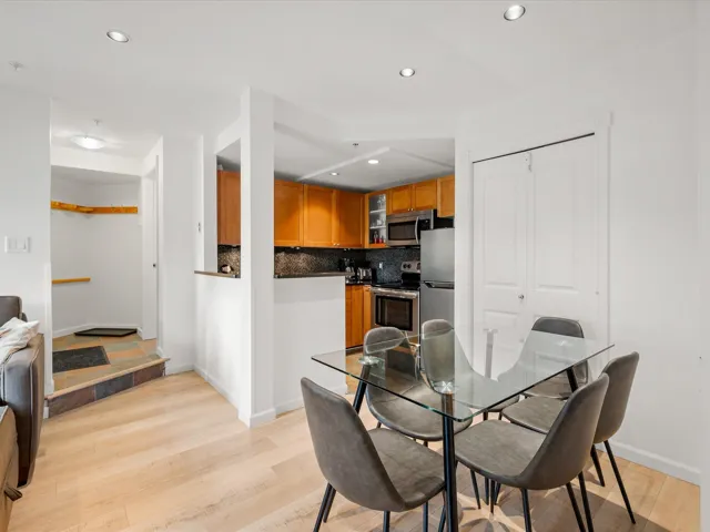 Dining room with light wood-style floors, recessed lighting, and baseboards