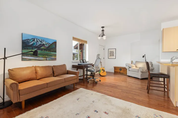 Living area with wood finished floors
