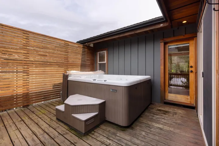 Wooden terrace with a hot tub