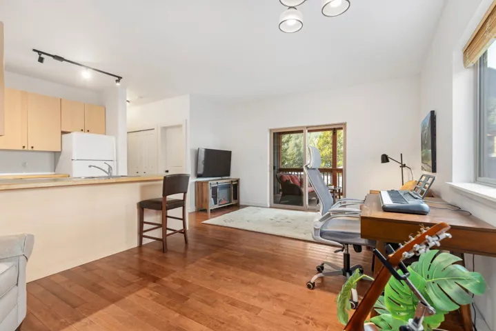 Office space with hardwood / wood-style floors