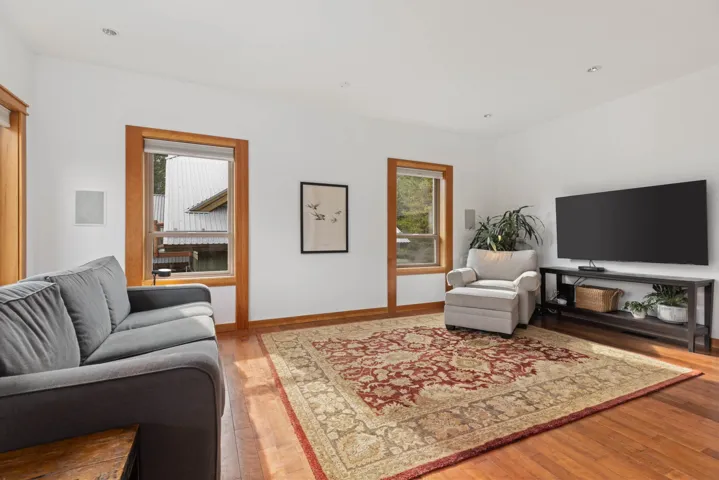 Living room featuring wood finished floors and baseboards