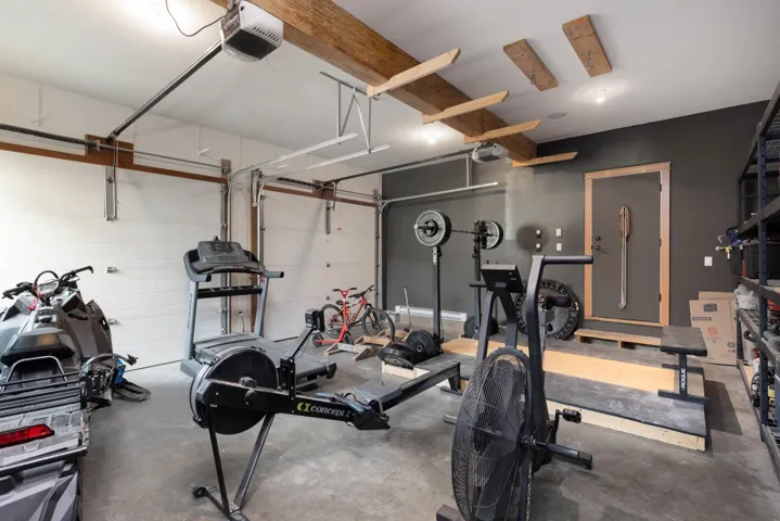 Workout room featuring a garage