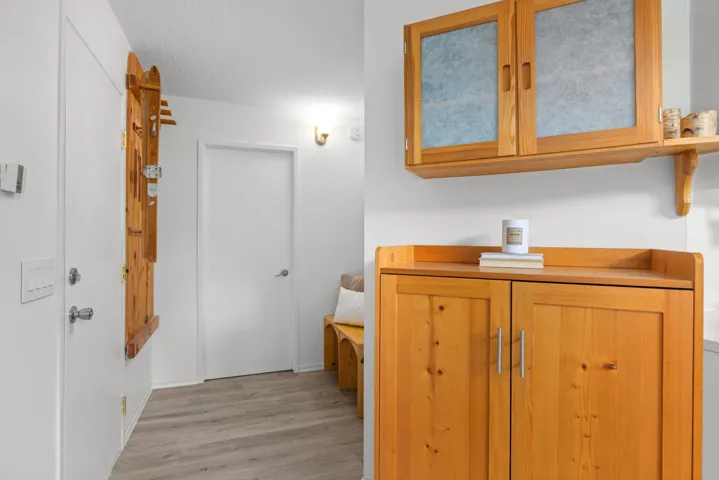 Bathroom featuring vanity, light wood-type flooring, and a textured ceiling