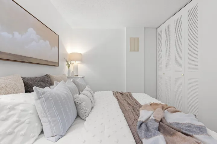 Bedroom with a closet and a textured ceiling
