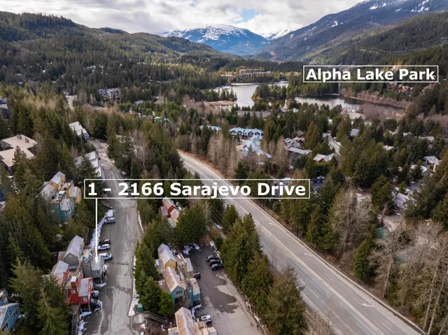 Aerial overview of property's location with property boundaries highlighted and a water and mountain view