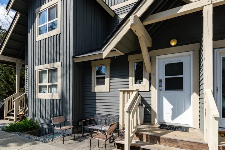 Entrance to property with a patio and board and batten siding