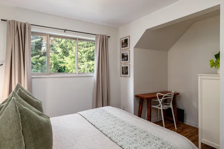 Bedroom with dark wood-style floors