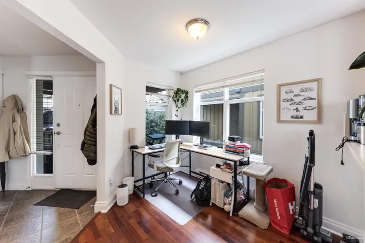 Office with wood finished floors and baseboards