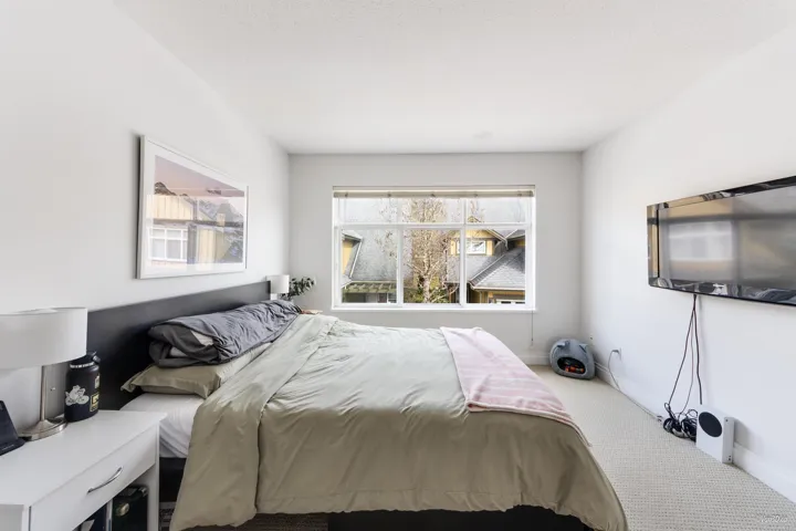 Carpeted bedroom featuring baseboards