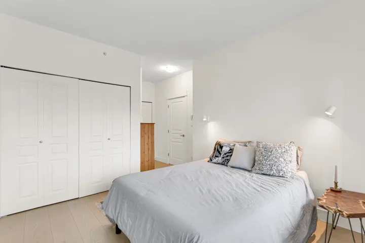 Bedroom featuring a closet and light wood-style floors