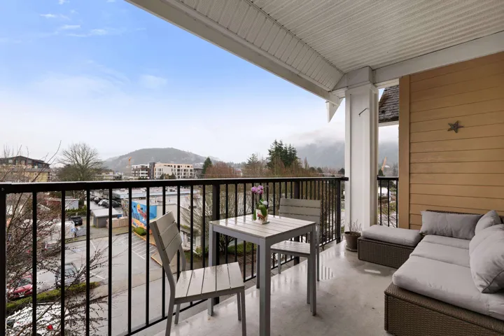 Balcony with an outdoor living space and a mountain view