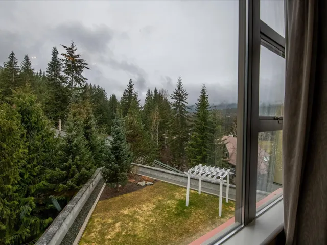 Exterior space featuring a wooded view