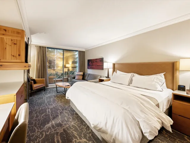 Bedroom with access to exterior, crown molding, and expansive windows