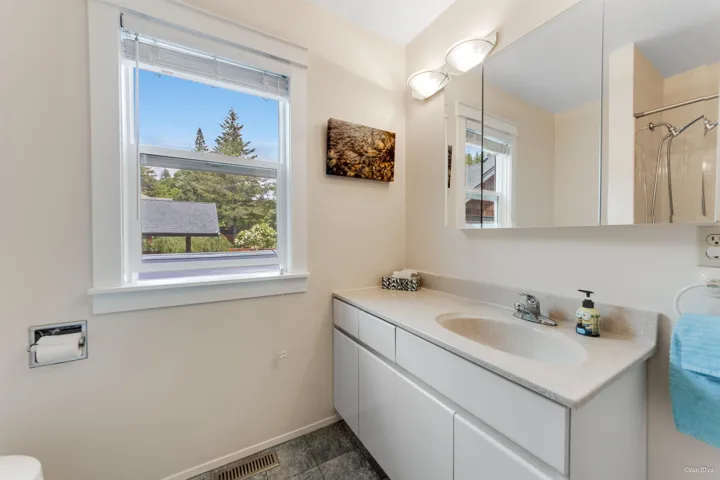 Bathroom with vanity and baseboards