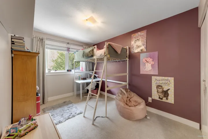 Bedroom featuring carpet floors, baseboards, and an office area
