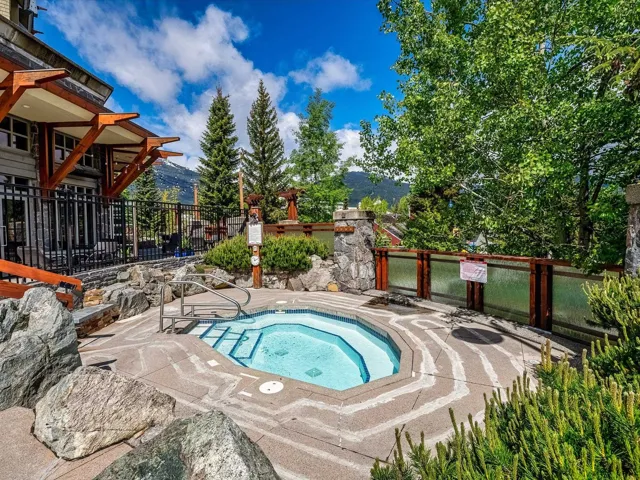 View of pool featuring a mountain view and a community hot tub