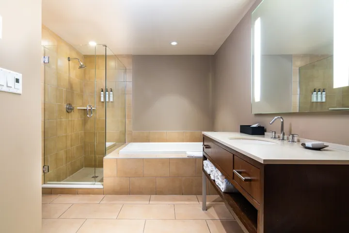 Full bath with a shower stall, vanity, a bath, tile patterned floors, and recessed lighting