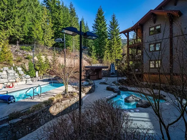 View of pool featuring a patio and fence