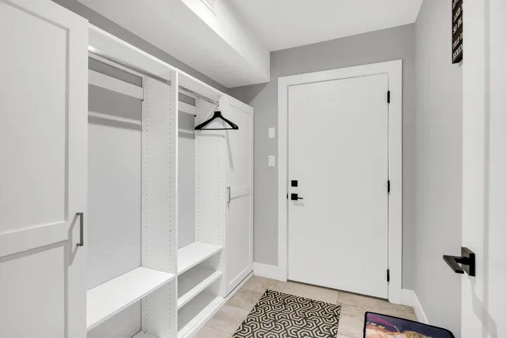 Mudroom with baseboards and light tile patterned flooring
