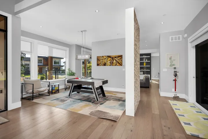 Dining area with hardwood / wood-style flooring and recessed lighting